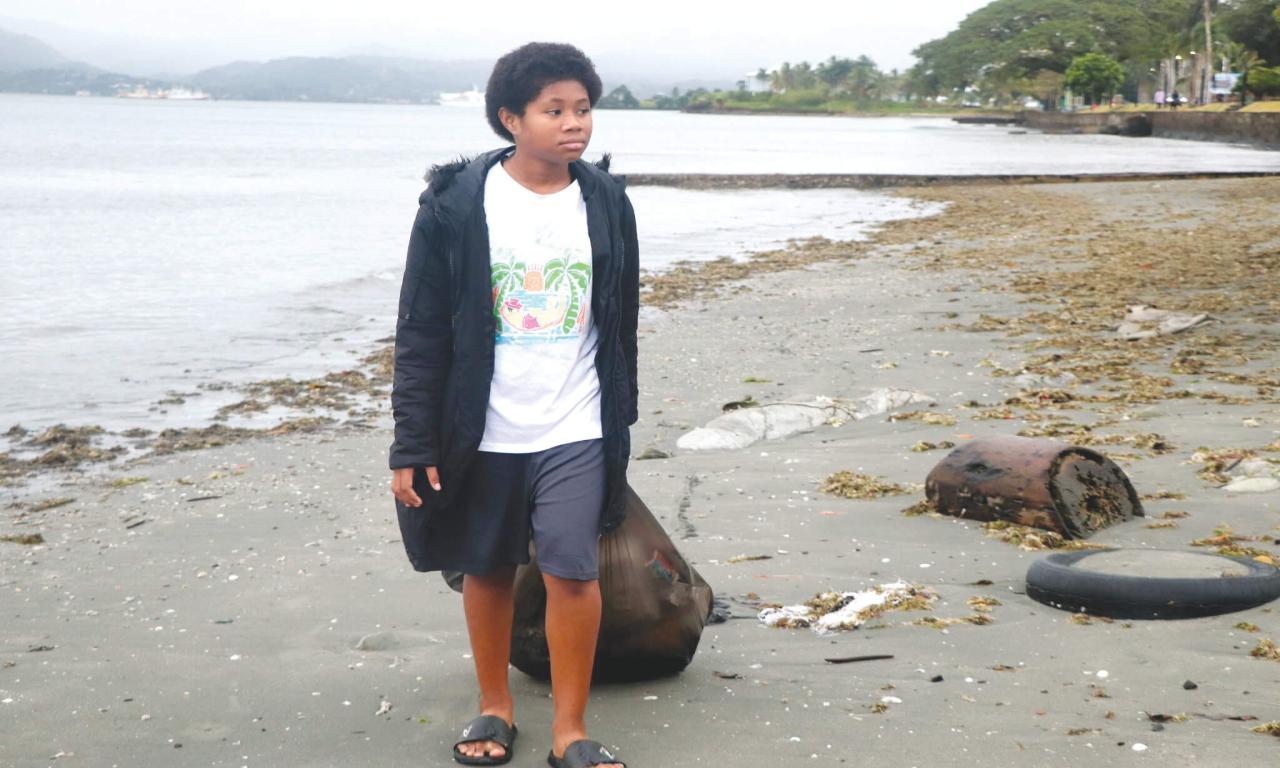 Young volunteer at the Nasese Foreshore clean-up, Suva