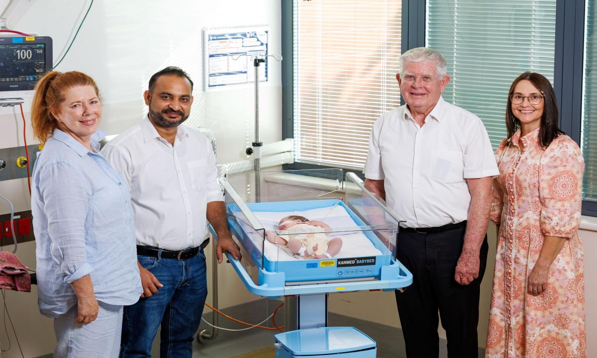 Mater Mothers’ Hospital: Fr Robert McCulloch (2nd from right) and St Elizabeth’s administrator Eric Siraj meet Mater newborn Armani-Rose Richards with (left) Mater Director of Clinical Governance Dr Christine Foley and Mater Mothers’ Hospital General Manager Kerri Gane.  