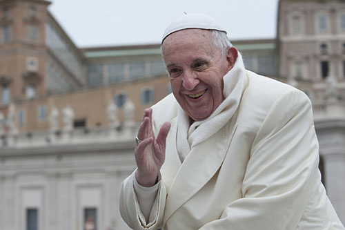 Pope Francis blesses faithful.