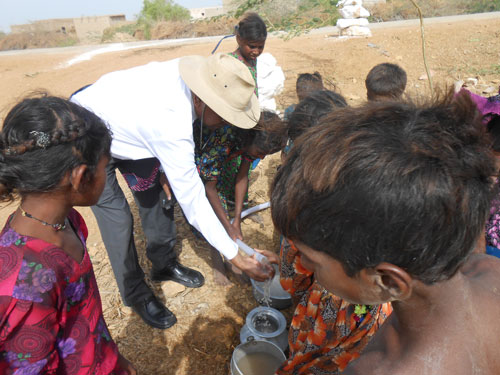 James Francis, Administrator of St Elizabeth Hospital embraces fresh water 