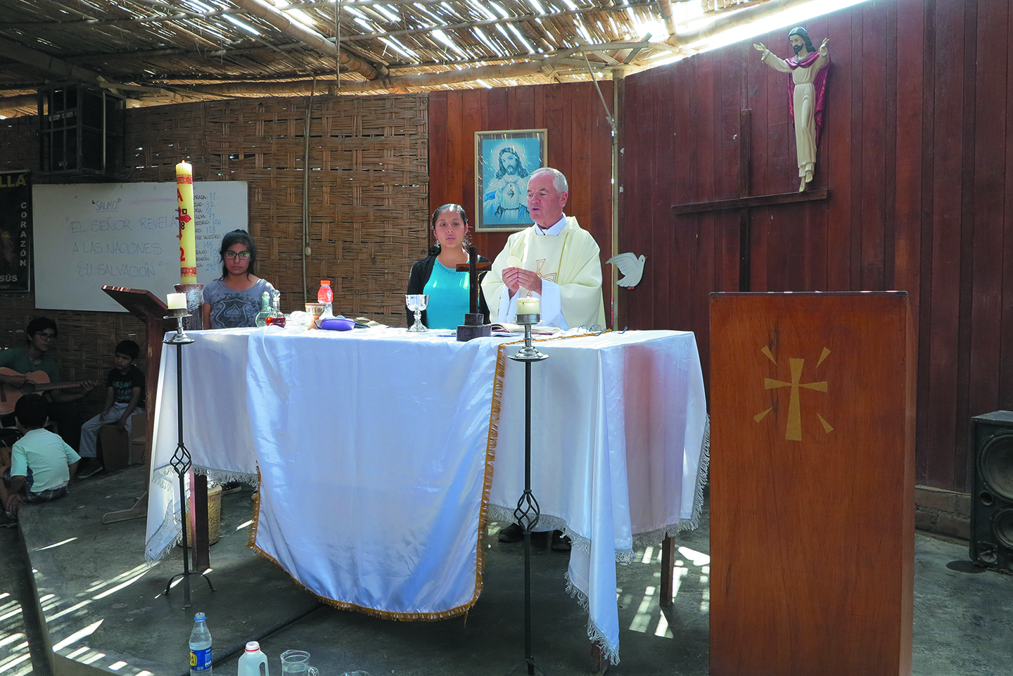 Isabel in her chapel as Eucharistic minister with Fr. John Boles  - Photo: Photos by Eduardo Salas, Director of Communications for the Columban Fathers in Peru.    