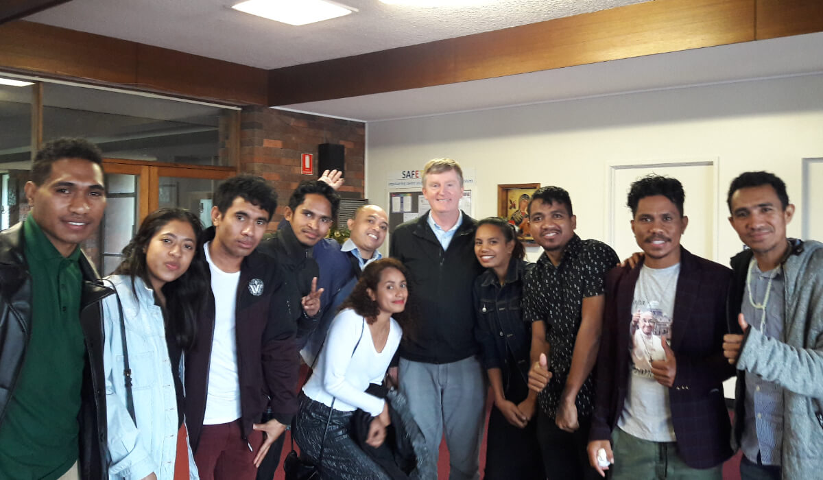 Fr Peter with Timorese workers Warrnambool in 2019. Photo: St Columbans Mission Society