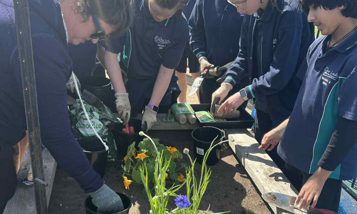 Columban co-worker Jacqui facilitates a session on caring for our common home and gardening with grade six students. Photo: Adi Mariana Waqa