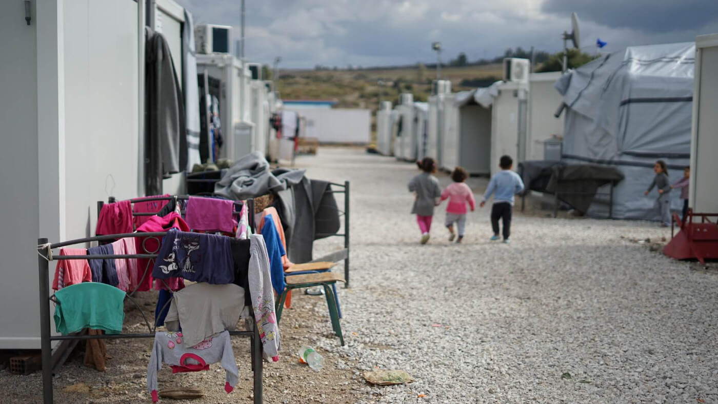 Syrian refugee camp in the outskirts of Athens. Photo: Julie Ricard on Unsplash
