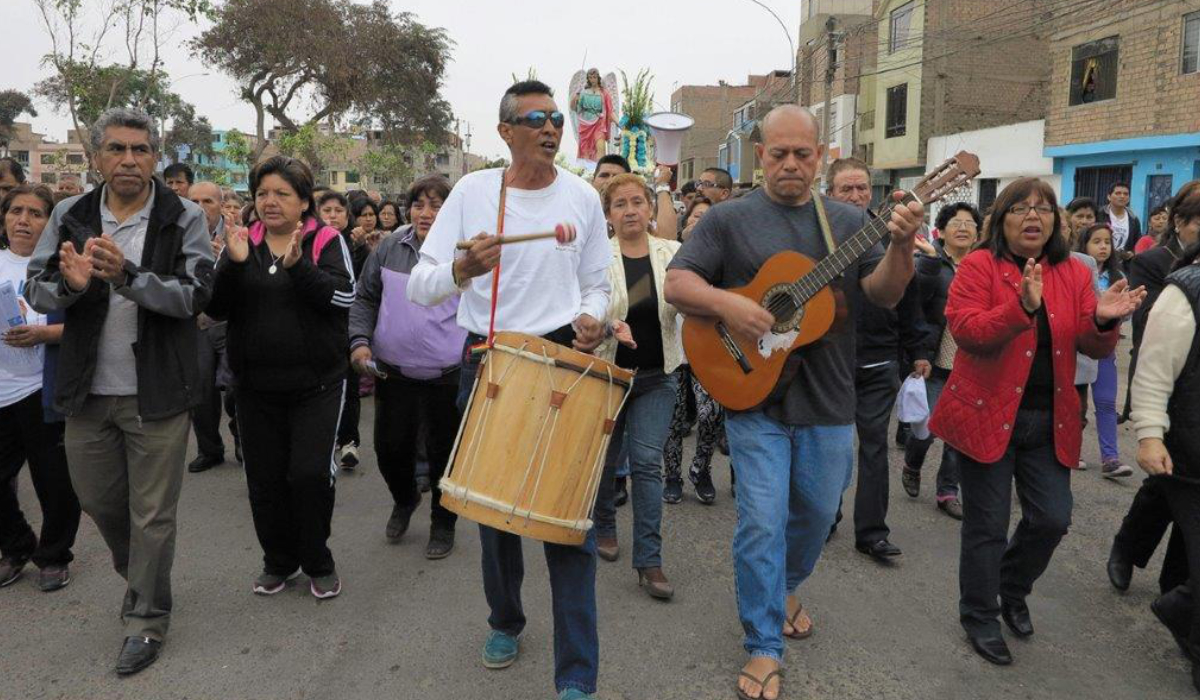Fr. Napa [on guitar], during a procession. Photo: Fr. Palanapa Tavo