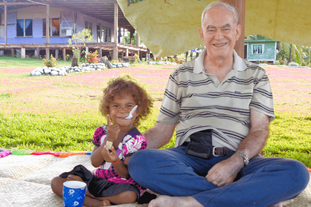 Fr Frank with a child during one of his pastoral visit to the village of Dogoru. Photo: Fr Frank Hoare