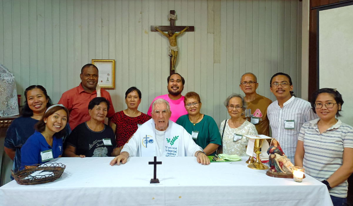 Lucille Arcedas (left) and other Mission Partners with Fr. Brian Gore during their recollection.