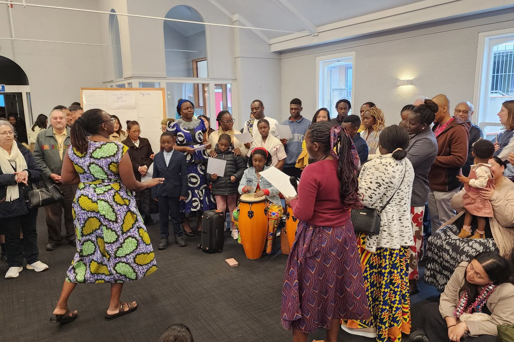 A song being performed by the African Community with Fr Don Hornsey. Photo: Fr Don Hornsey