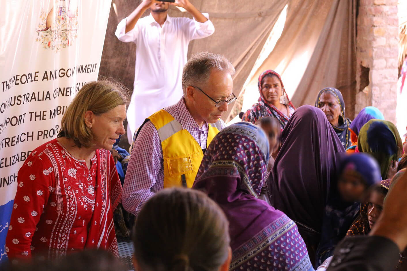 Neil Hawkins, the Australian High Commissioner to Pakistan speaks with people from Goth Patel Khuda village. Photo: Fr Robert McCulloch