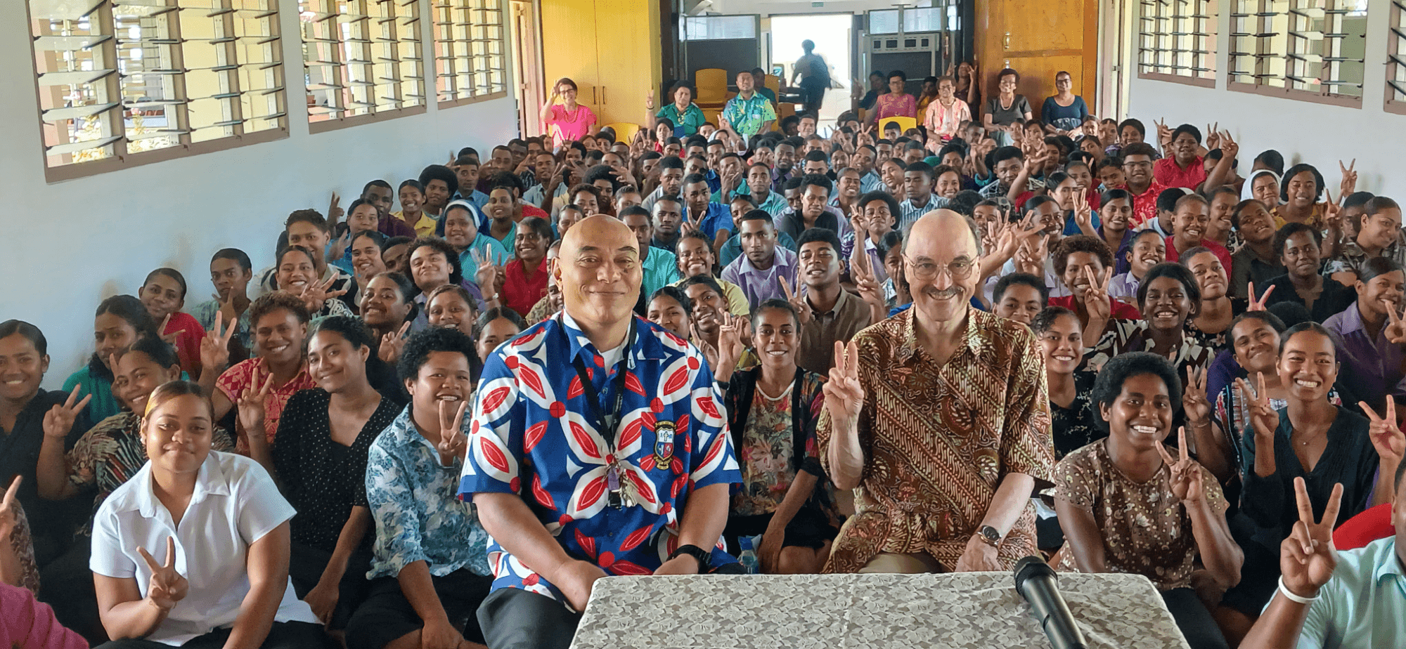Leo Lefebure with students and teachers at Corpus Christi