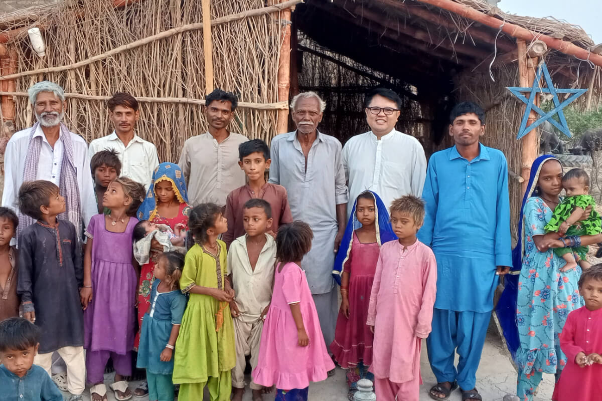 Fr Elbert (back row second from right) with the community standing outside their newly built chapel - a space for prayer and a representation of hope. Photo: Fr Elbert Balbastro