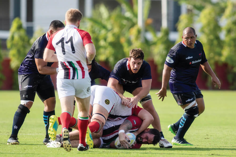 UAE Rugby Team (white/red) plays against Guam Rugby team (blue) during Day 1 of Asia Rugby Championship Div 2 on May 15, 2019 at True Arena in Hua Hin, Thailand. Photo: Mai Groves/shutterstock.com
