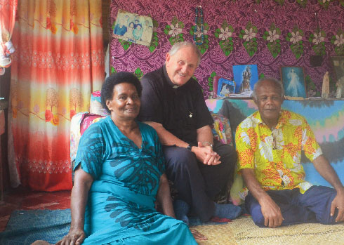 Fr Donal McIlraith with a parishioners. Photo: Fr Donal McIlraith SSC