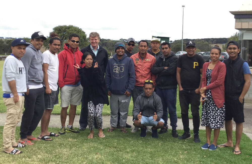 Fr Peter O'Neill with the Timorese workers, Warrnambool. Photo: Fr Peter O'Neill SSC