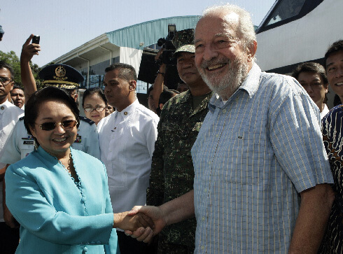 Philippine President Gloria Macapagal Arroyo greets released Irish priest, Fr Michael Sinnott, upon his arrival at the Villamor air base in Manila. Photo: © Romeo Ranoco/REUTERS/Adobe Stock