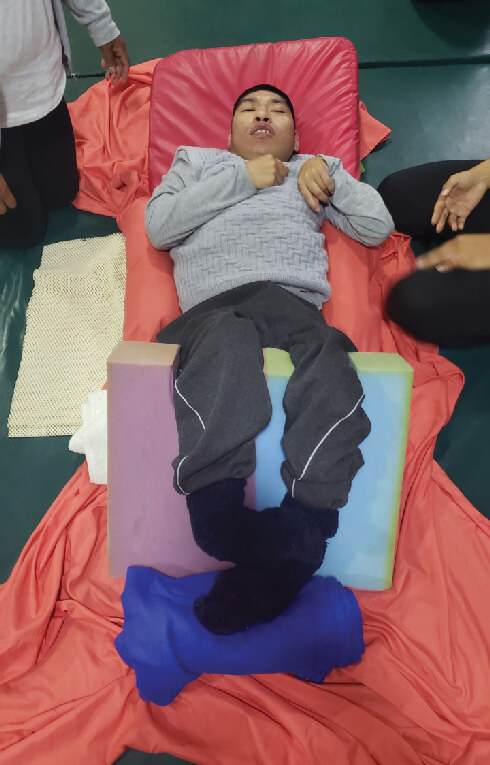 David at home on his orthopedic bed, Peru. Photo: John Boles SSC