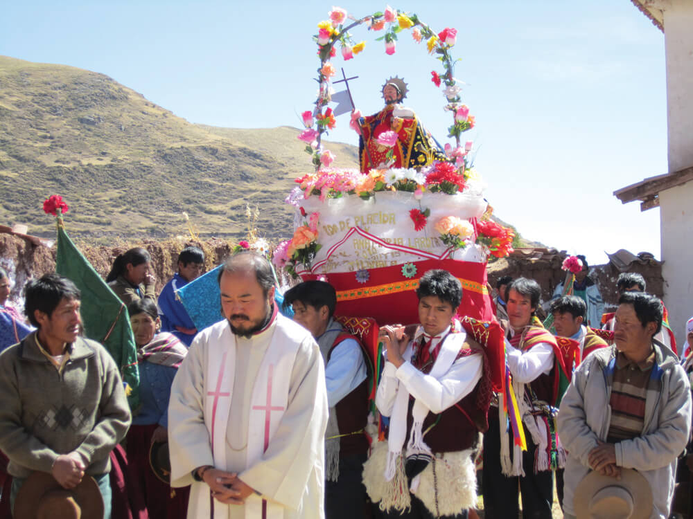A traditional Peruvian procession taking place in the highlands of Peru from where many of the people in this barrio have migrated. Photo: Fr Peter Woodruff SSC