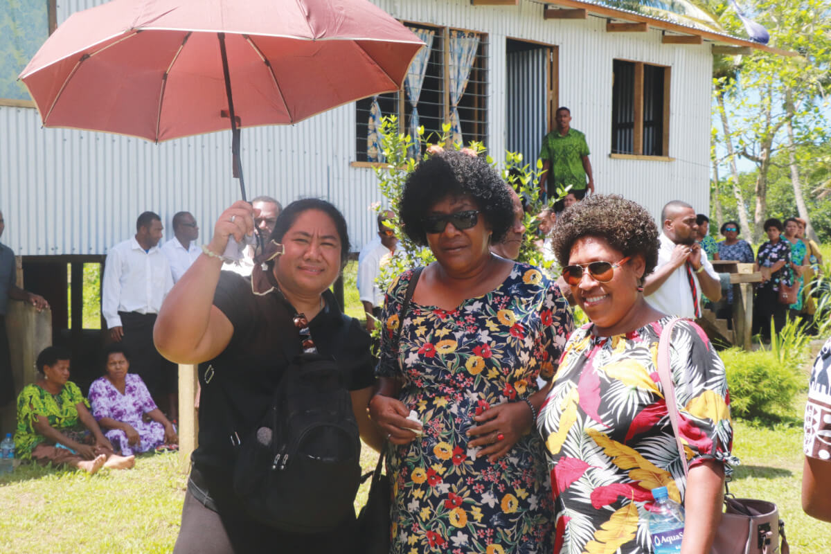 Columban lay missionaries Naanise Mo'unga (left) and Vosita Lenisaurua with Columban office staff member, Soela Matai (right) at the funeral. Photo: Fr Donal McIlraith SSC