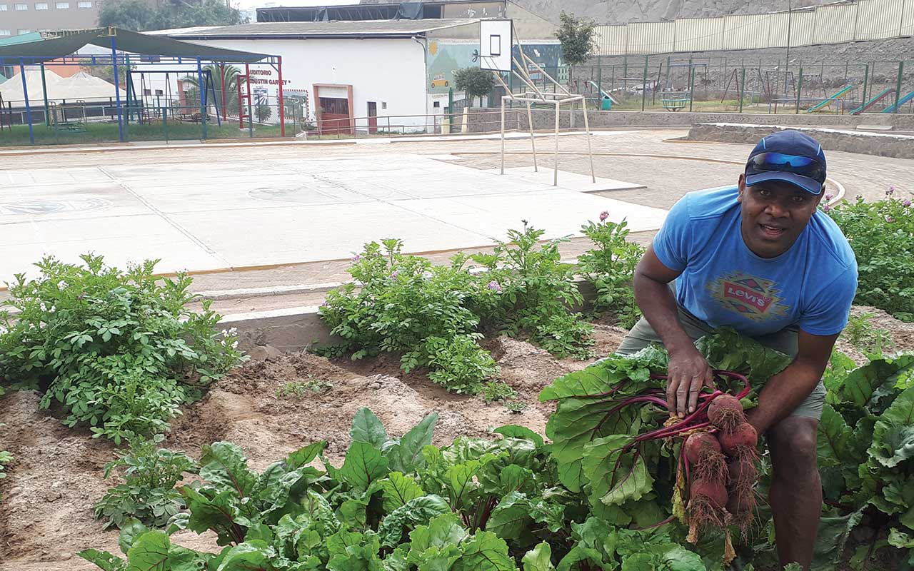 Columban seminarian Iowane Naio assisting with the gardening. Photo: Juan Diego Torres - Communications Team Peru