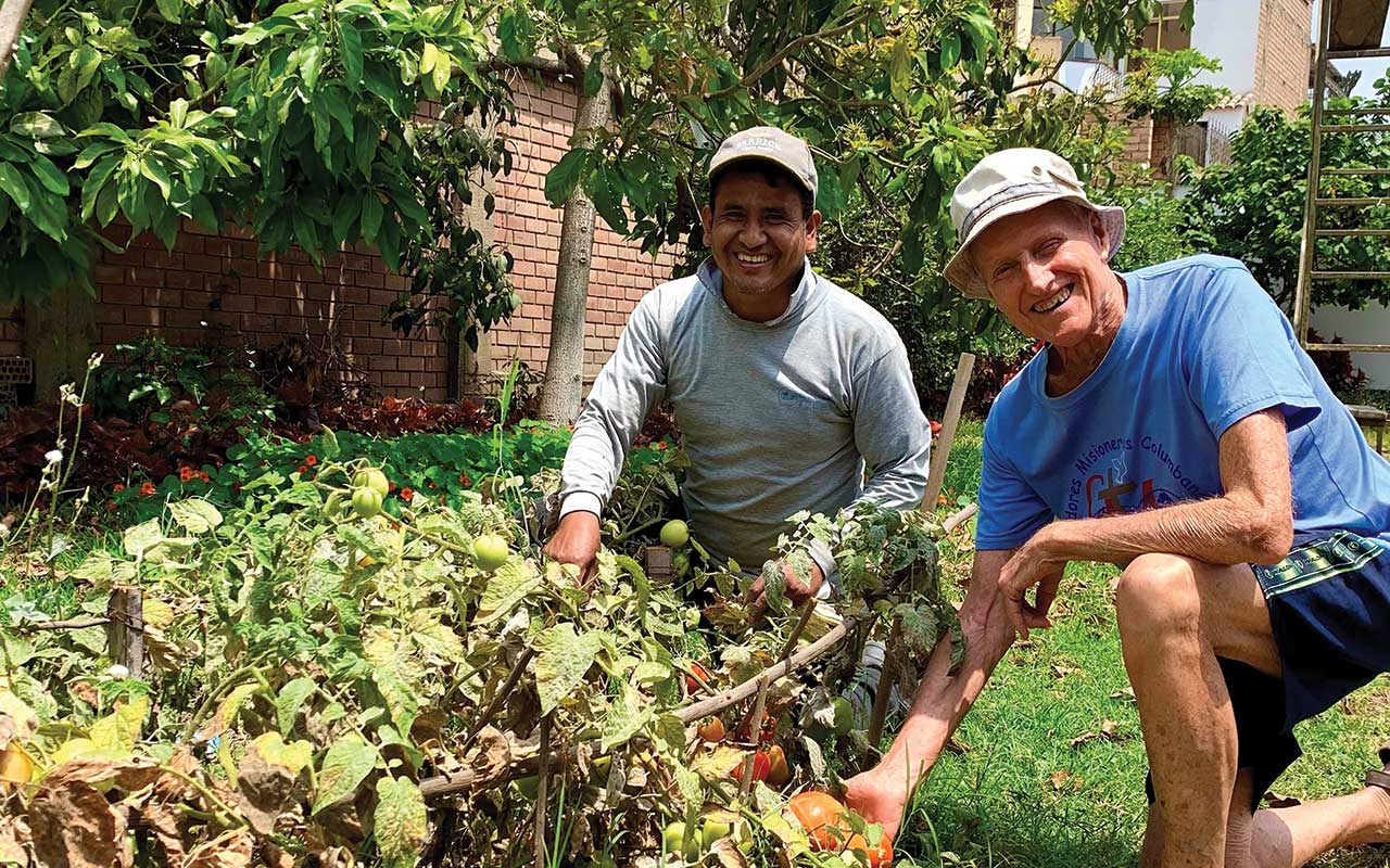 Fr John Hegerty and Gaspar gardening at the mini farm in Lima, Peru. Photo: Juan Diego Torres - Communications Team Peru