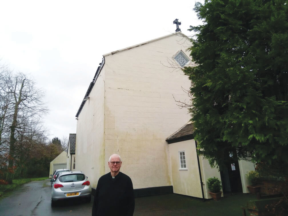Parish priest, Fr Des Seddon, outside his beloved St Mary's church. - Photo:St Columbans Mission Society