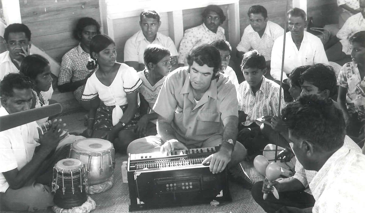 A young Fr Frank Hoare singing with Indo-Fijian parishioners - Photo: Fr Frank Hoare