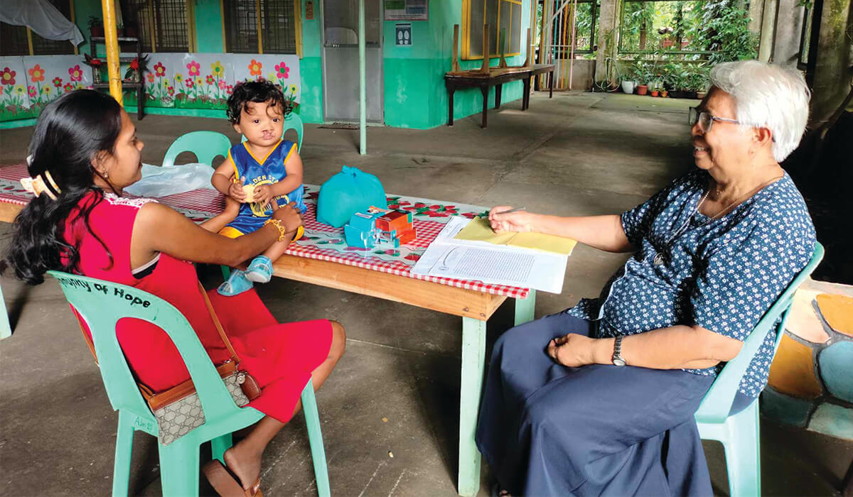 Sr Cecilia Cuizon advises a mother at the Community of Hope Special Education Centre. - Photos: Sr Gloria Santos SSC