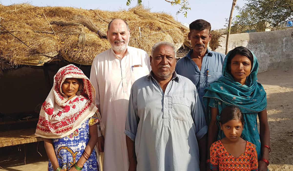Columban Fr Tomás King with a Pakistani family from the Diocese of Hyderabad - Photo: Fr Pat Raleigh SSC