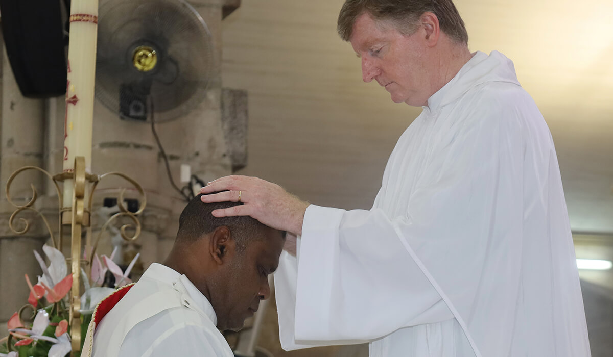 Oceania Regional Director, Fr Peter O'Neill, blesses Fr Iowane during his ordination. - Photo: St Columbans Mission Society