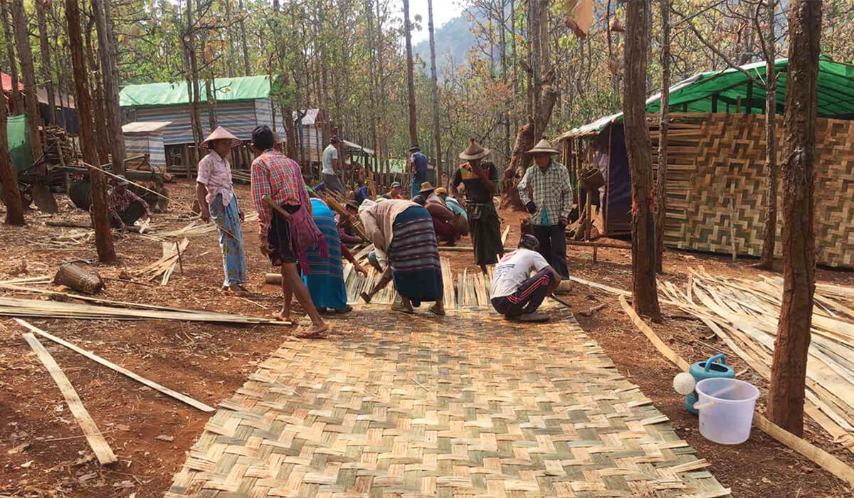 Parishioners, living as refugees in the jungles of Myanmar, band together to build a new school. - Photo: Fr Leo Schumacher SSC