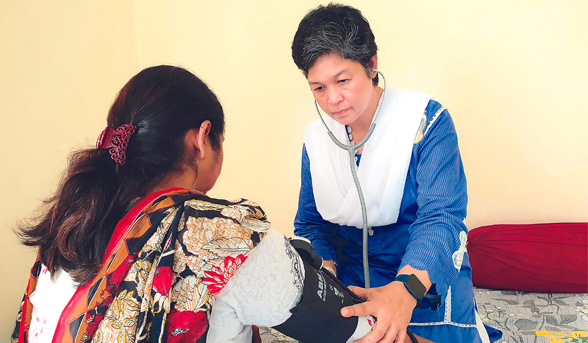 Sr Anne on a home visitation with the sick in Pakistan. Photo: Sr Anne Carbon