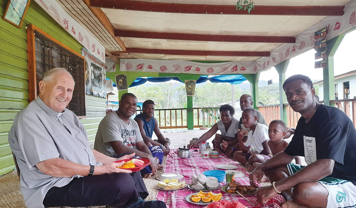 Columban Fr Donal McIlraith (left) enjoying lunch with villagers of Saliadrau in Fiji. - Photo: Fr Donal McIlraith