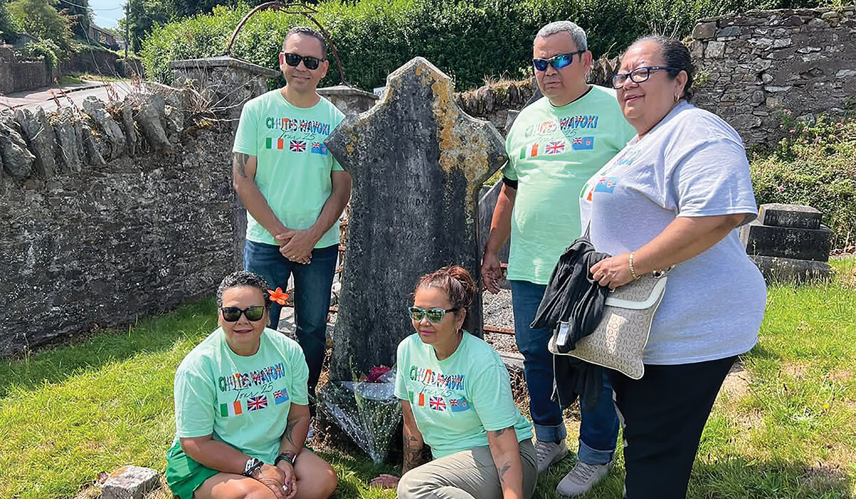 The Chute family surrounding their great grandfather John's grave at Pembroke, Co Cork, Dalgan Park, in Ireland. - Photo; Fr Pat Colgan