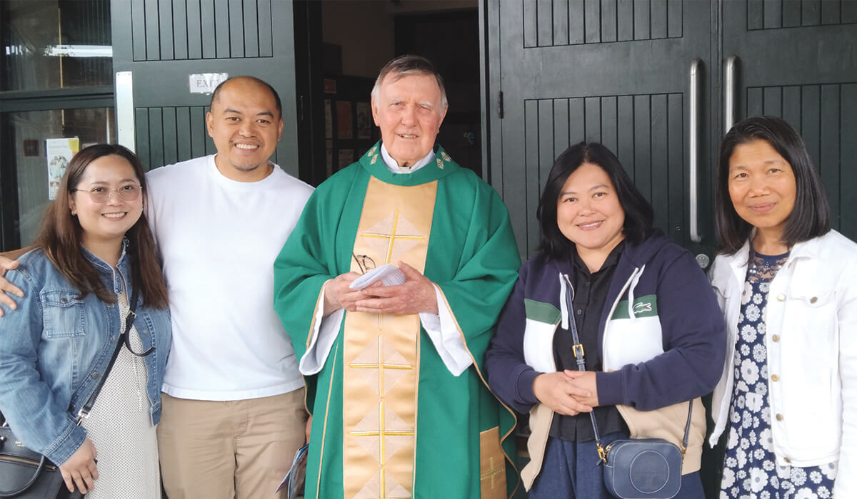 Angie (far right) with fellow lay missionary Sherryl Lou Capili standing beside her, Columban Fr Sean Coyle (centre) and Sherryl Lou’s brother and sister-in-law (left) during a mission appeal at St Charles Borromeo in Leixlip, Ireland. - Photo: Angelica Escarsa
