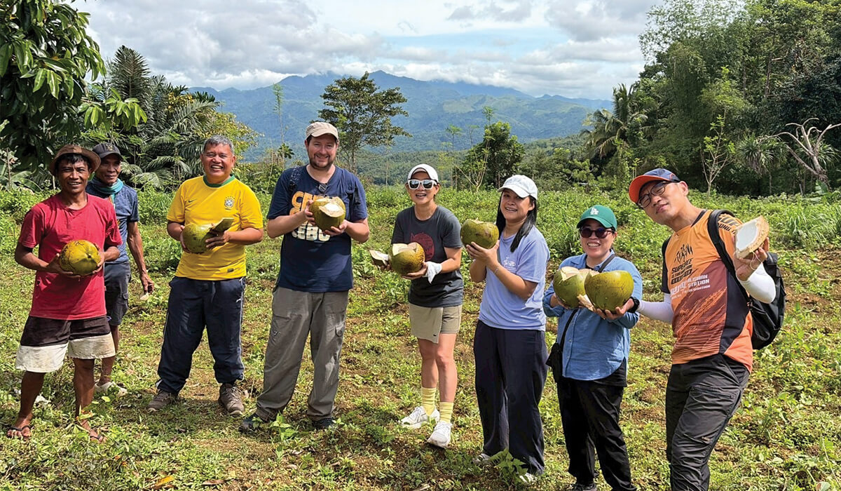Jao Resari (third from right) visiting the Reforestation Project, Bantolinao Farm, with John Din (third from left), fellow Columban missionaries and local farmers. Photo: Jao Resari